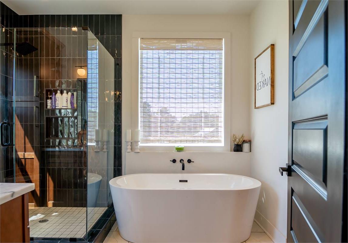 Primary Ensuite Bath With Soaking Tub & Walk-In Shower image of Chelci House Plan