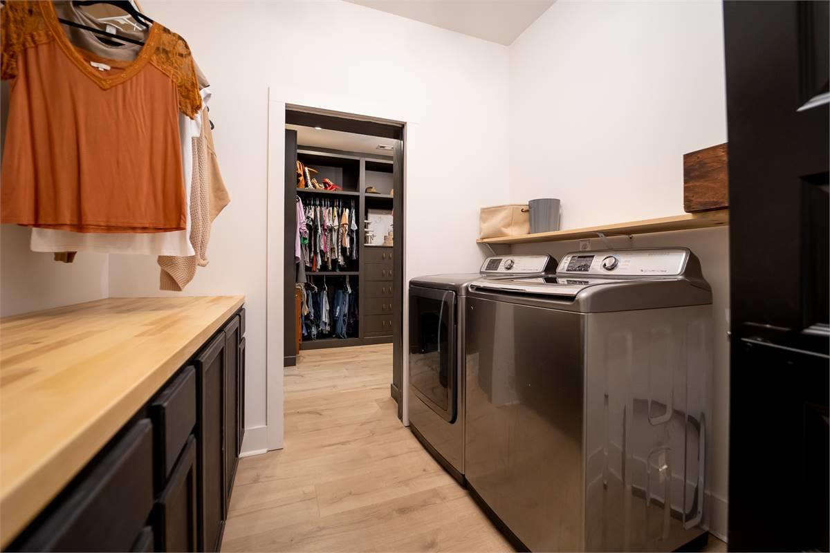 Laundry Room Conveniently Located Near Kitchen image of Chelci House Plan