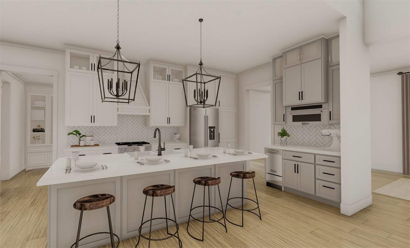 Open Concept Kitchen Featuring KitchenAid® Appliances image of Richmond Avenue House Plan