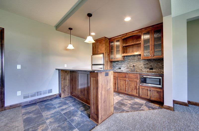 Wet Bar image of 3-Story Craftsman with Sport Court House Plan